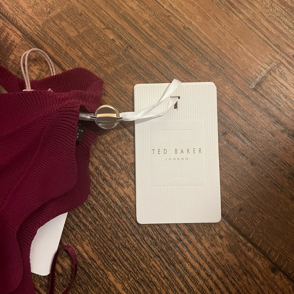 Ted Baker maroon dress with cutouts at bottom of dress
